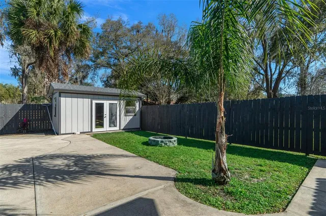 a view of a green field with lots of bushes