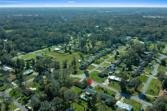 an aerial view of a house with a garden
