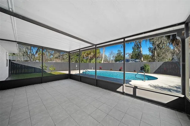 a living room with a large bed and a large window