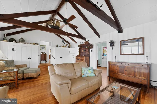 a room with furniture and a floor to ceiling window
