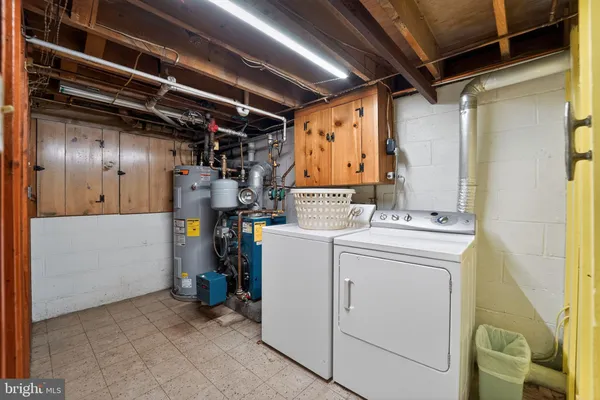 a bedroom with furniture and a wooden floor