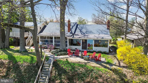 a view of a house with a yard and garden
