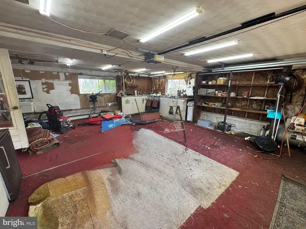 a view of a garage with a car parked