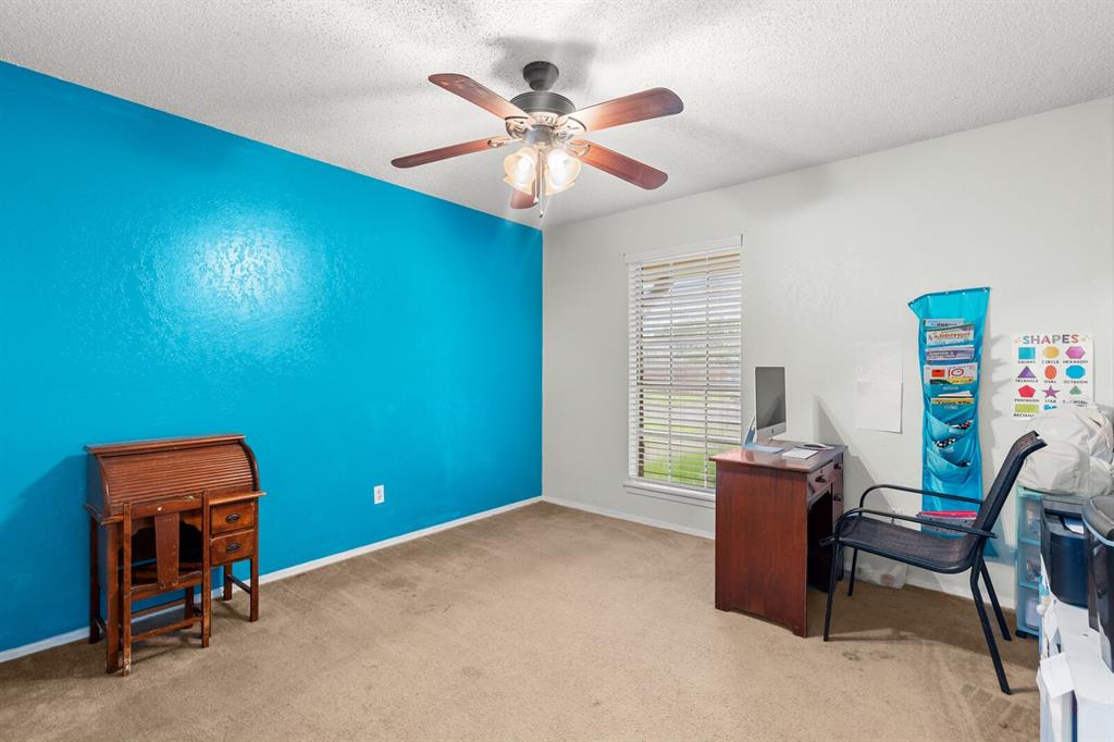 505 Pinewood Lane Hewitt, TX 76643 - Photo 23 of 38 Carpeted room featuring a ceiling fan with light fixture, a window with blinds, and white baseboards