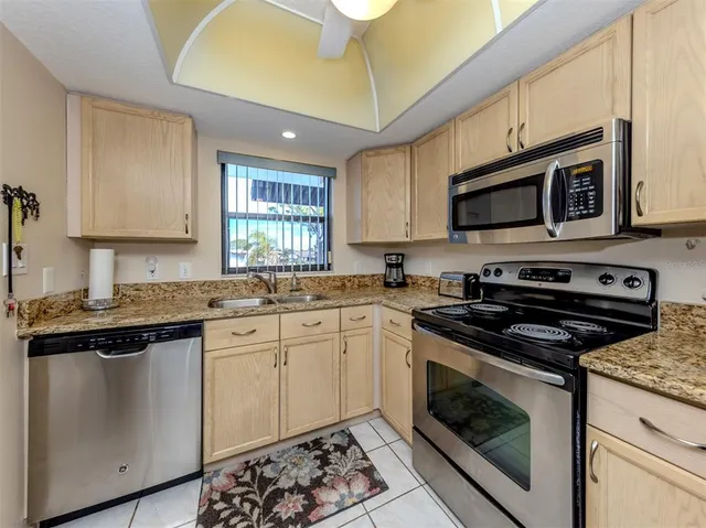 a bedroom with a bed and a lamp