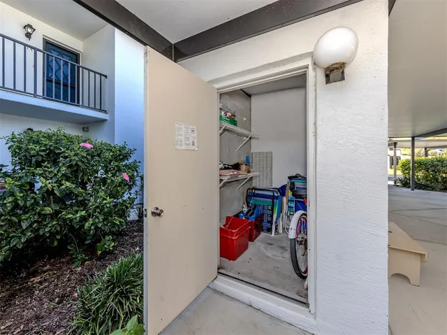 a view of a balcony with table and chairs