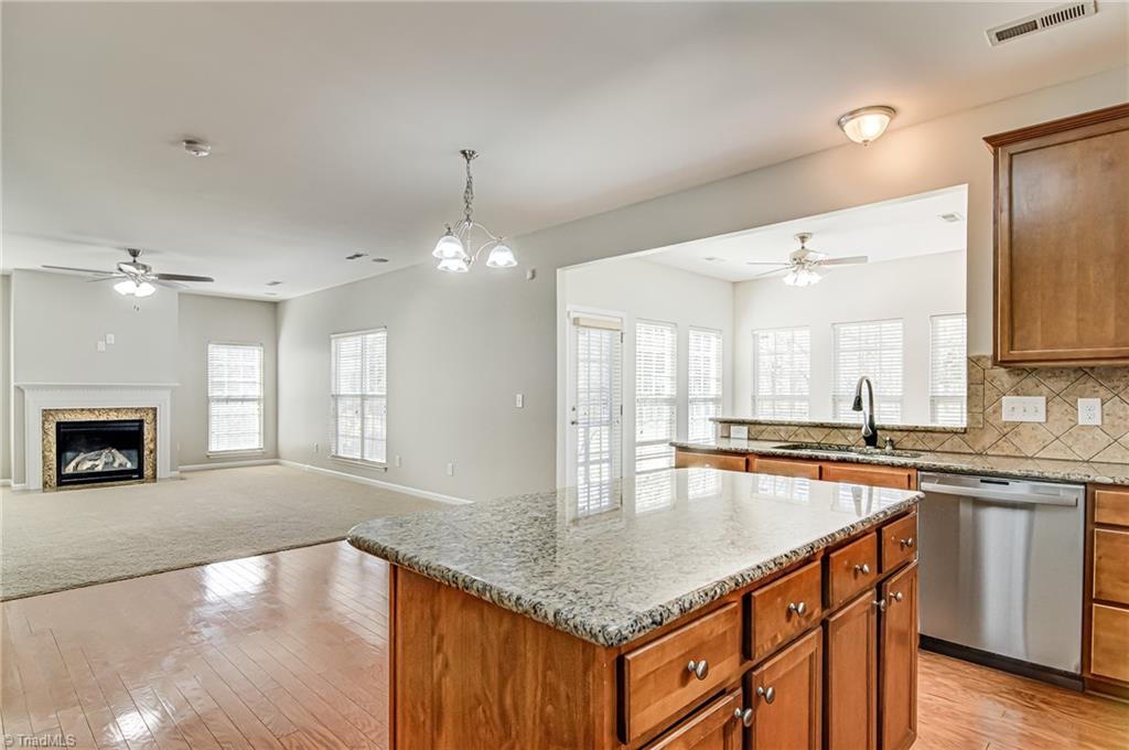 5421 Broadleaf Road Summerfield, NC 27358 - Photo 11 of 30 the kitchen is open to the family room.
