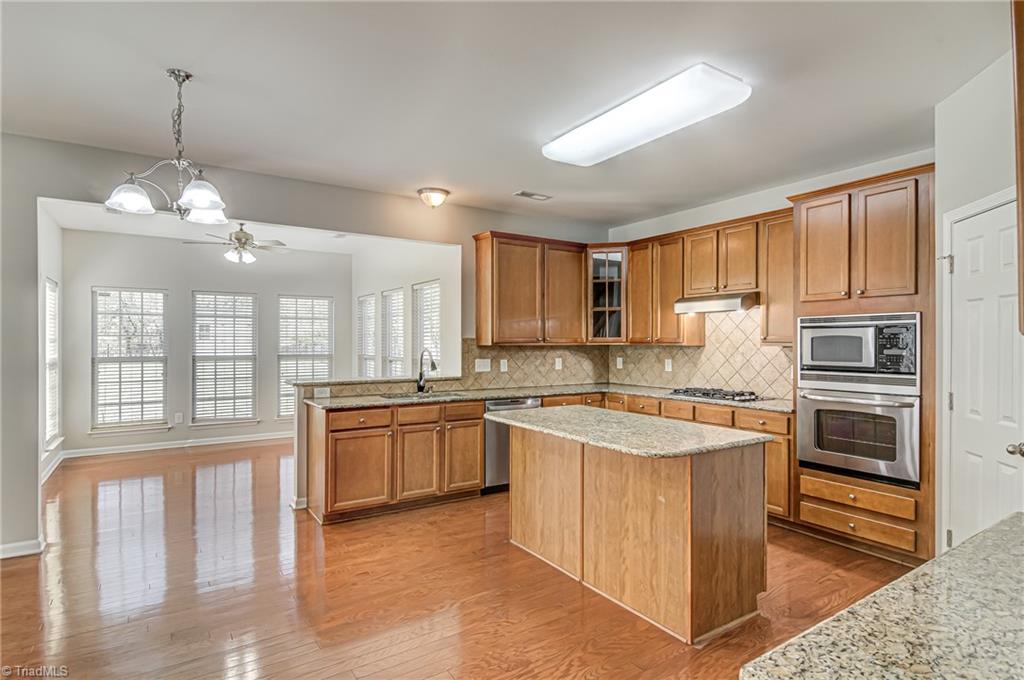 5421 Broadleaf Road Summerfield, NC 27358 - Photo 5 of 30 Billed a "gourmet kitchen" by the builders, this option provides the cook with a gas cooktop, stainless steel built in appliances .