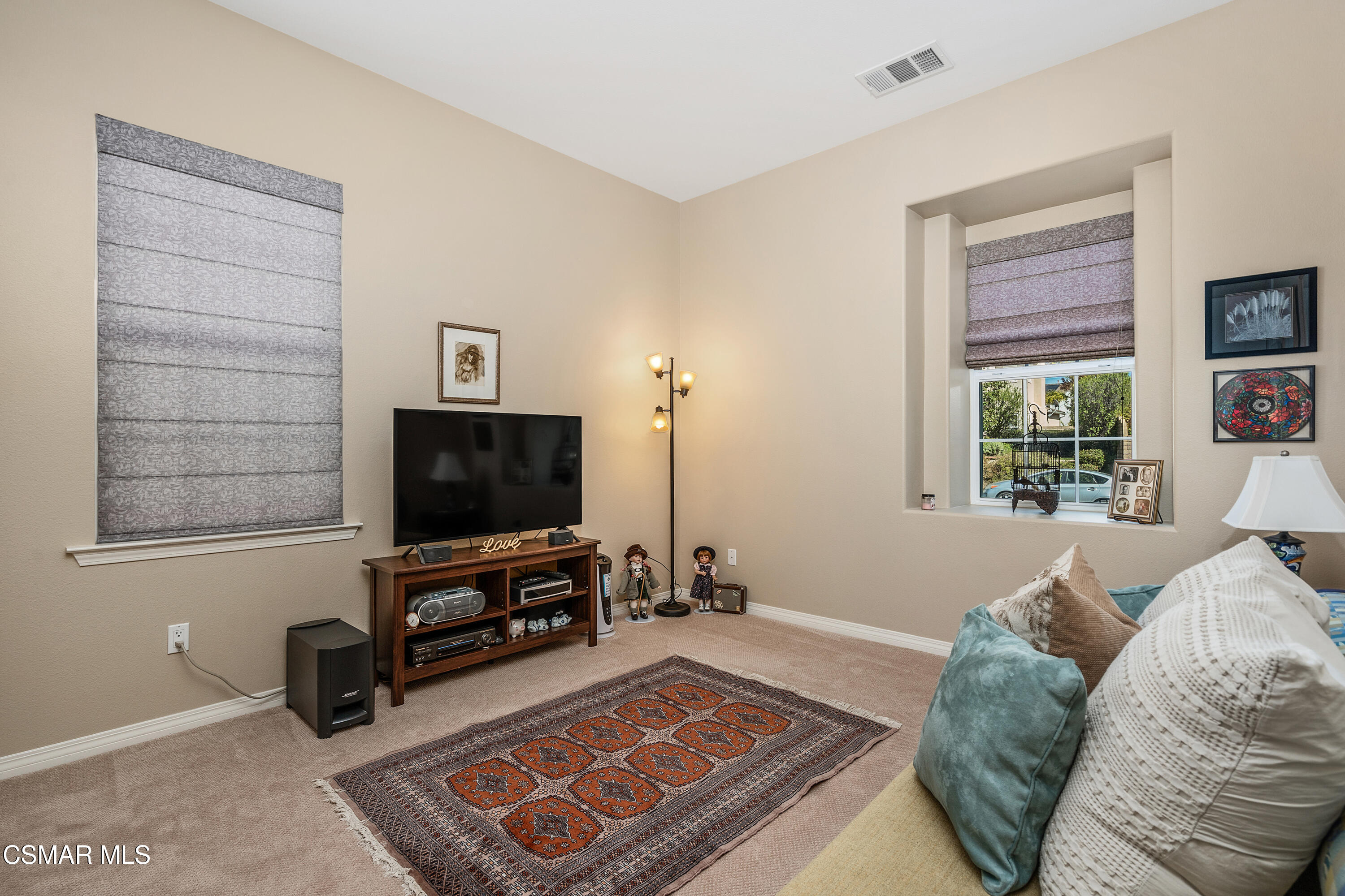 6835 Blue Ridge Way Moorpark, CA 93021 - Photo 13 of 39 a living room with furniture and a flat screen tv