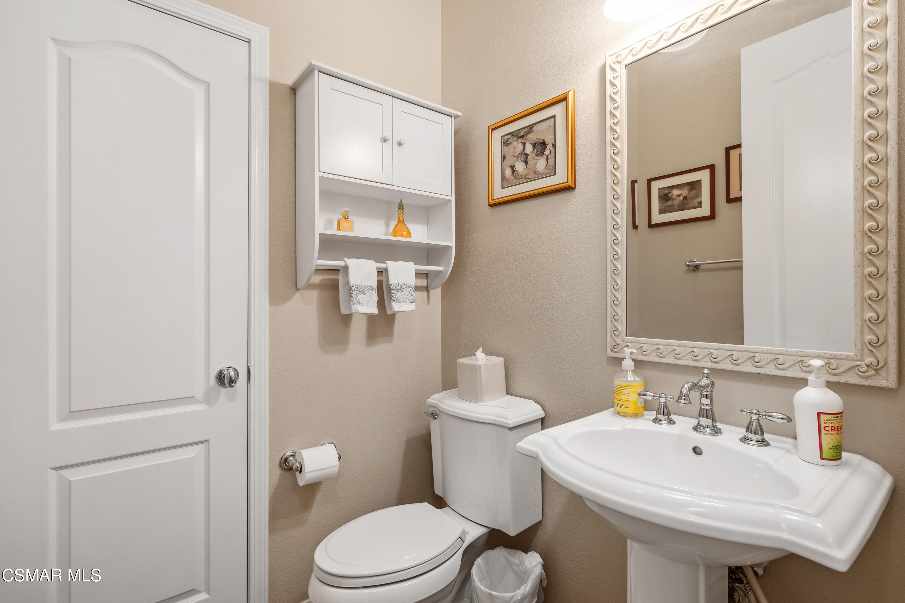 6835 Blue Ridge Way Moorpark, CA 93021 - Photo 17 of 39 a bathroom with a sink mirror vanity and toilet