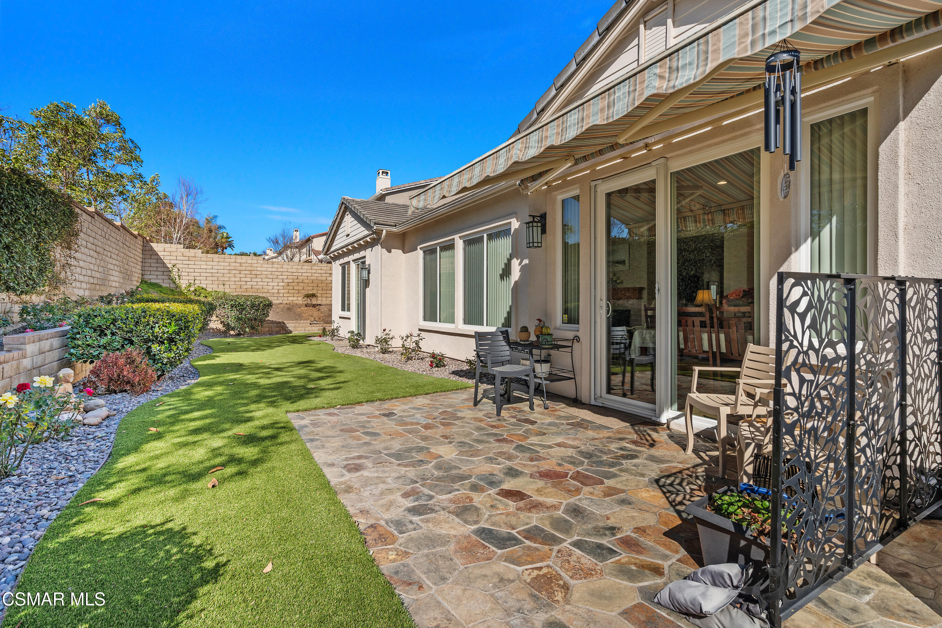6835 Blue Ridge Way Moorpark, CA 93021 - Photo 30 of 39 a view of a chair and table in backyard of the house
