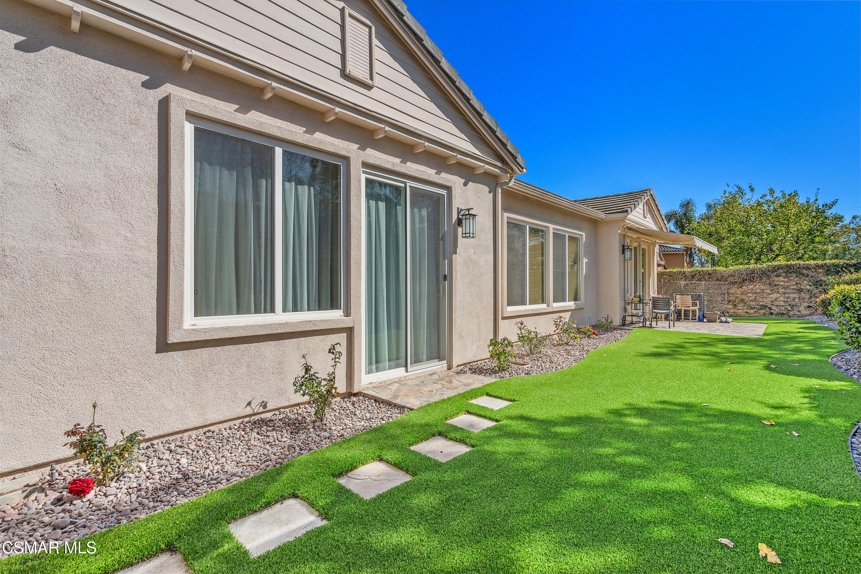 6835 Blue Ridge Way Moorpark, CA 93021 - Photo 31 of 39 a front view of a house with a garden
