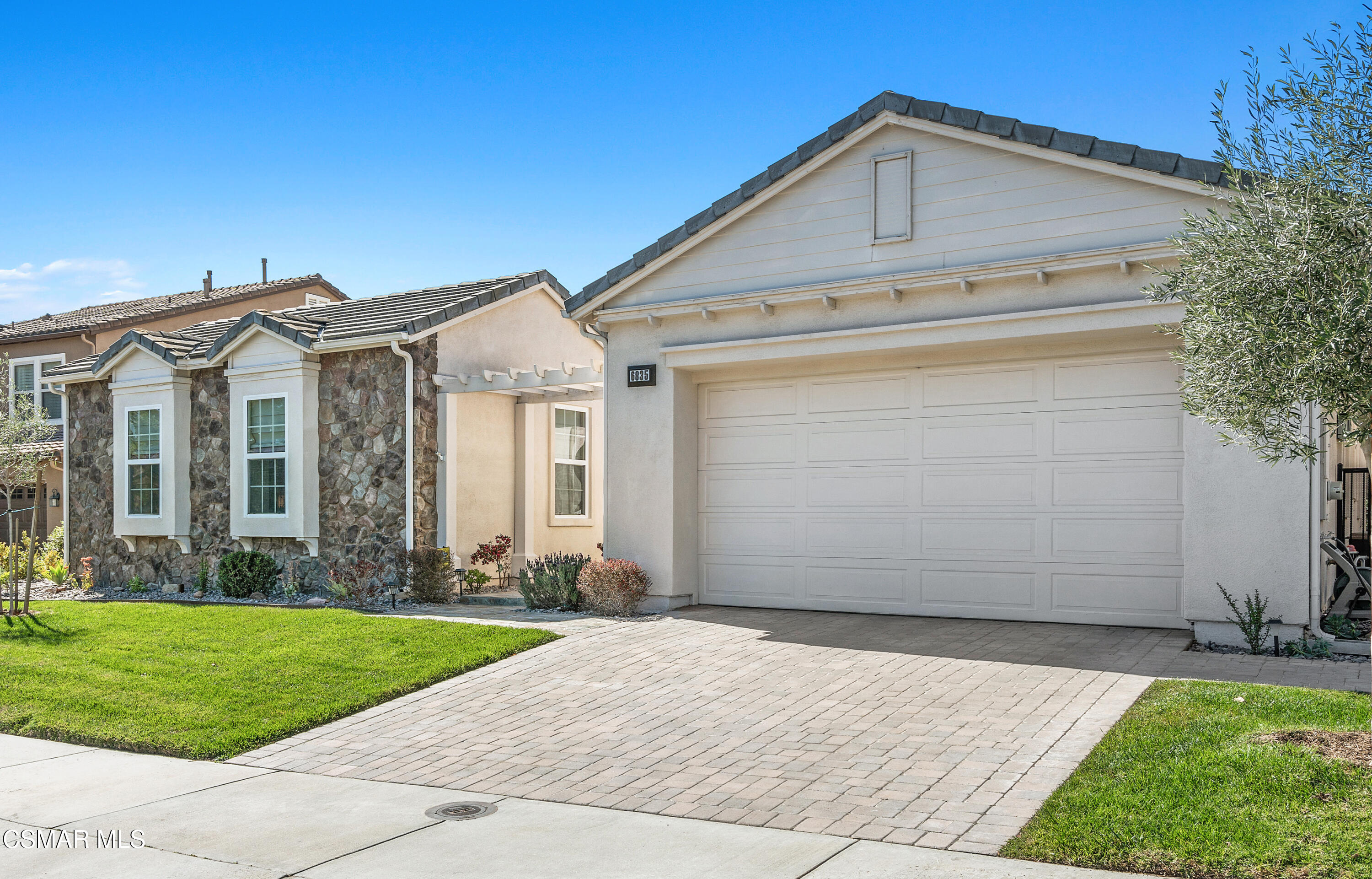 6835 Blue Ridge Way Moorpark, CA 93021 - Photo 33 of 39 a front view of a house with a yard