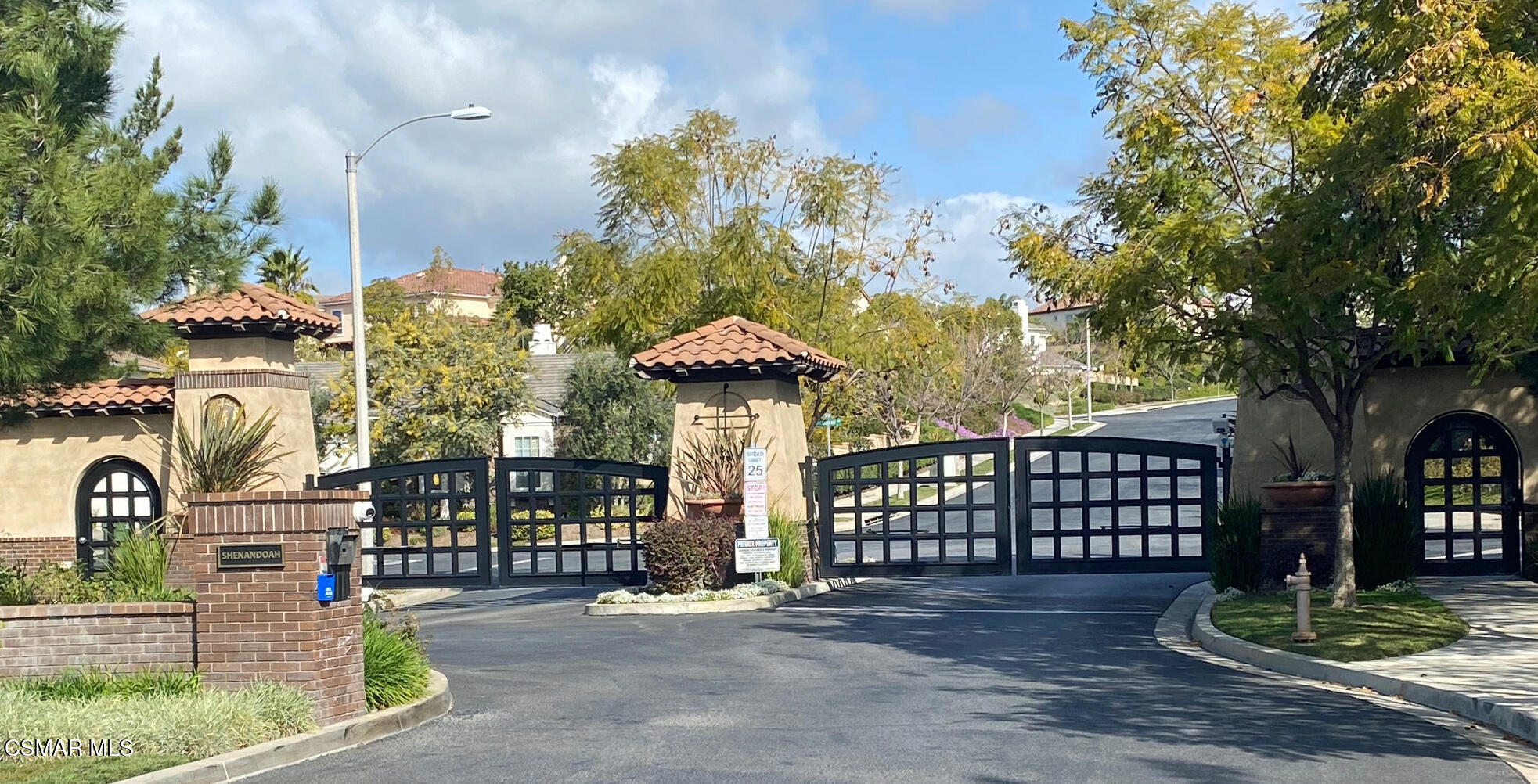 6835 Blue Ridge Way Moorpark, CA 93021 - Photo 34 of 39 a view of a street with potted plants and large trees