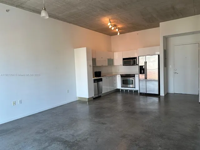 a view of a kitchen with a sink