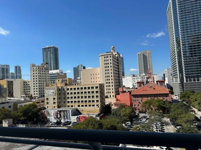 a view of a city with tall buildings