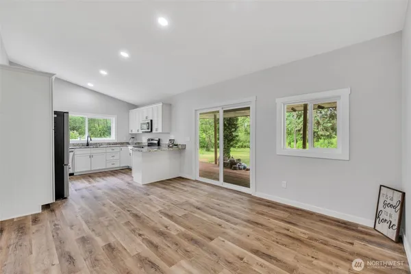 a view of a kitchen with a sink and a window