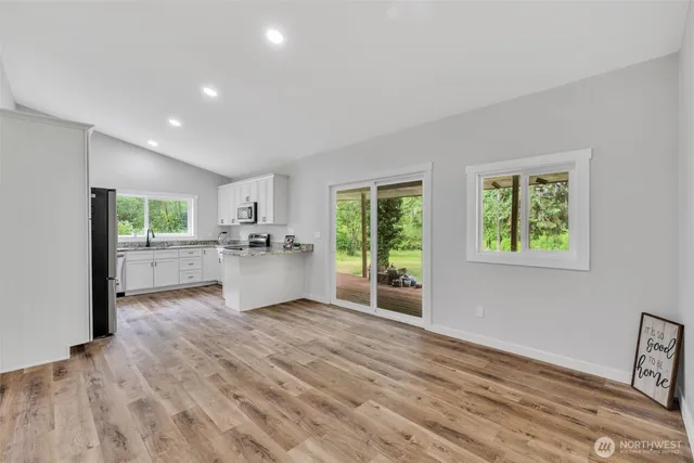 a view of a kitchen with a sink and a window