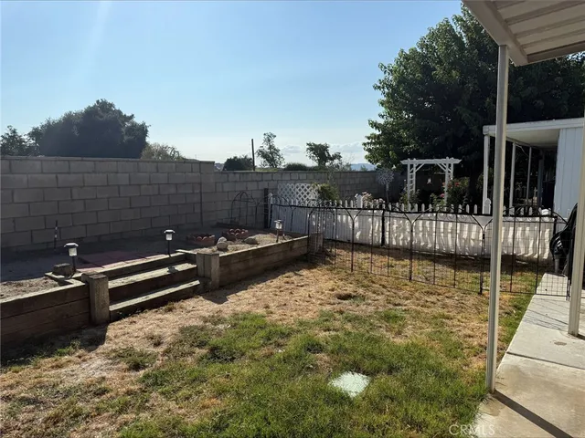 a view of a roof deck with couches and wooden floor
