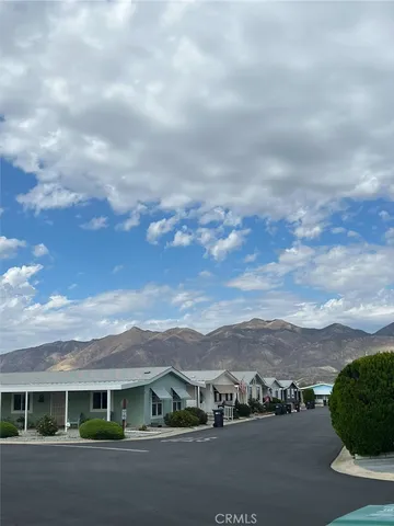an aerial view of houses with a street