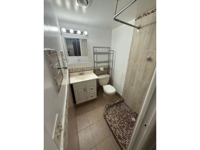 a utility room with sink dryer and washer