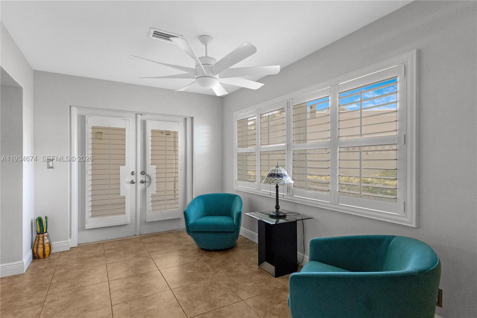 3401 Northeast 21st Avenue Lighthouse Point, FL 33064 - Photo 18 of 38 a living room with furniture and a window