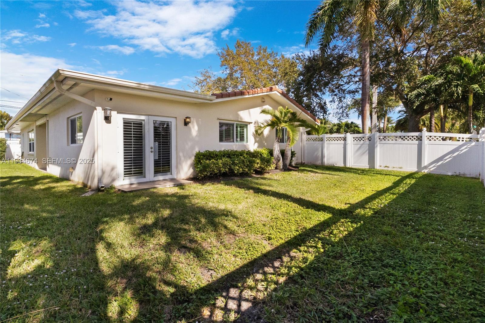 3401 Northeast 21st Avenue Lighthouse Point, FL 33064 - Photo 32 of 38 a view of a house with a yard
