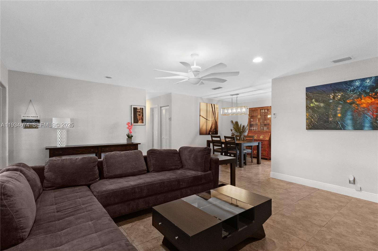 3401 Northeast 21st Avenue Lighthouse Point, FL 33064 - Photo 8 of 38 a living room with furniture and wooden floor