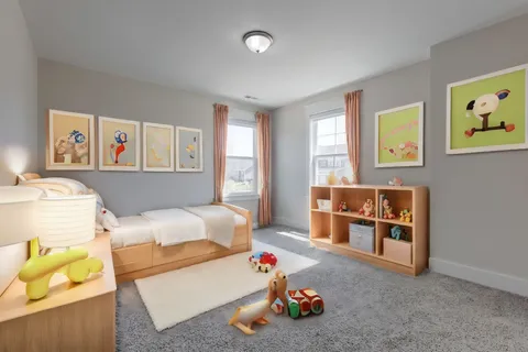 a bedroom with furniture and a book shelf