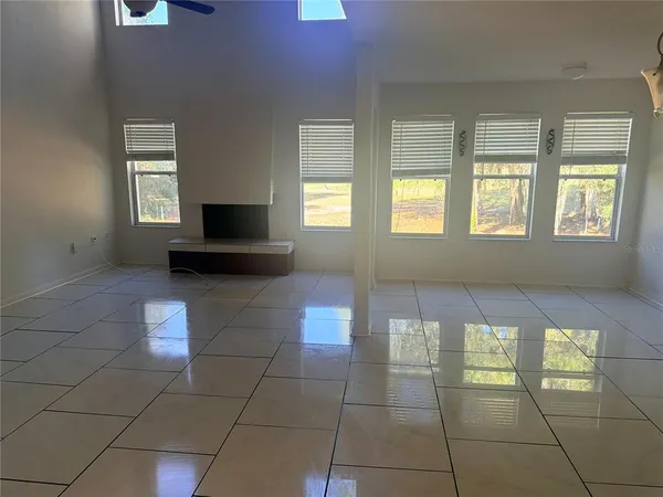 a bathroom with a shower and a glass door