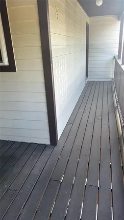 an empty room with a bench and cabinet