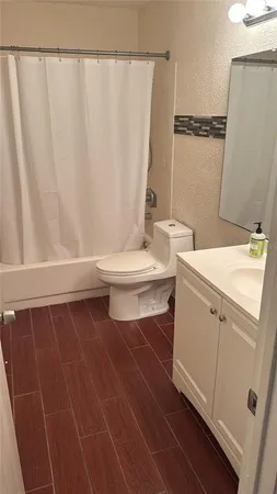 a bathroom with a toilet and a sink
