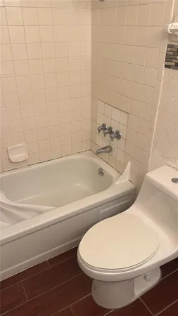 a view of a room with an empty space and window