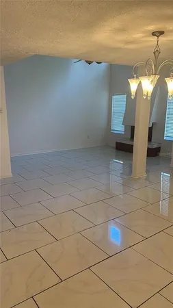 a white refrigerator freezer and a stove sitting inside of a kitchen