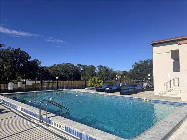 a view of swimming pool with a yard