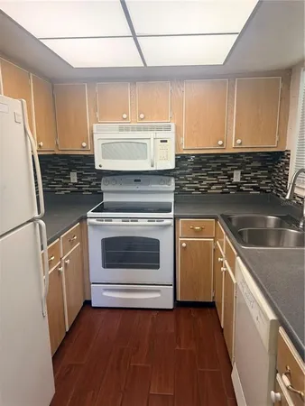 a view of a livingroom with fireplace and window