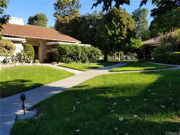 a view of a garden with a bench
