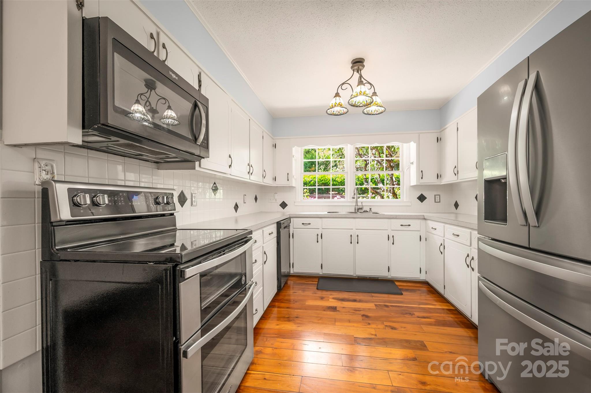 147 Anne Street Rutherfordton, NC 28139 - Photo 11 of 31 a kitchen with a refrigerator stove and sink