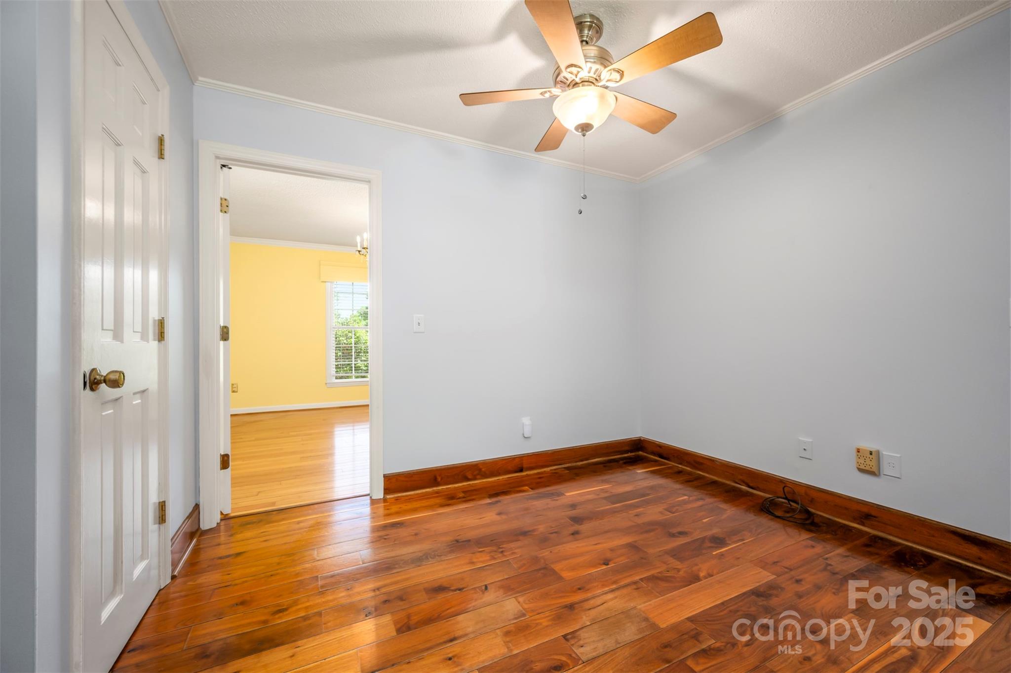 147 Anne Street Rutherfordton, NC 28139 - Photo 13 of 31 a view of an empty room with closet and a chandelier fan