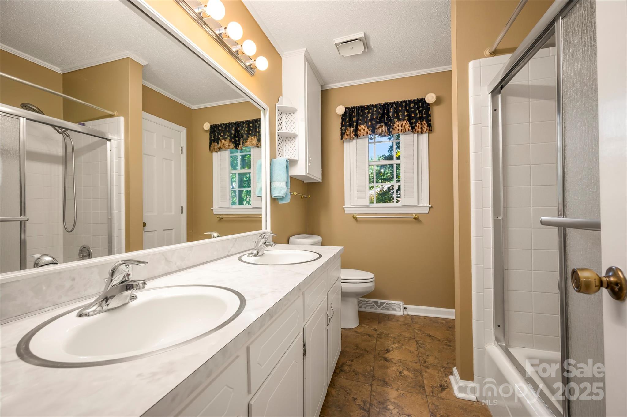 147 Anne Street Rutherfordton, NC 28139 - Photo 21 of 31 a bathroom with a granite countertop sink toilet and shower