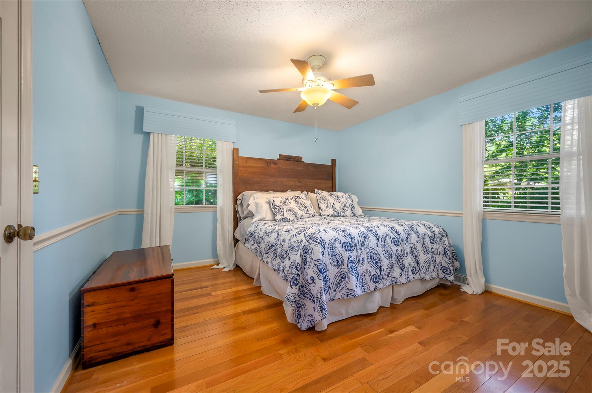 147 Anne Street Rutherfordton, NC 28139 - Photo 22 of 31 a bedroom with a bed and wooden floor