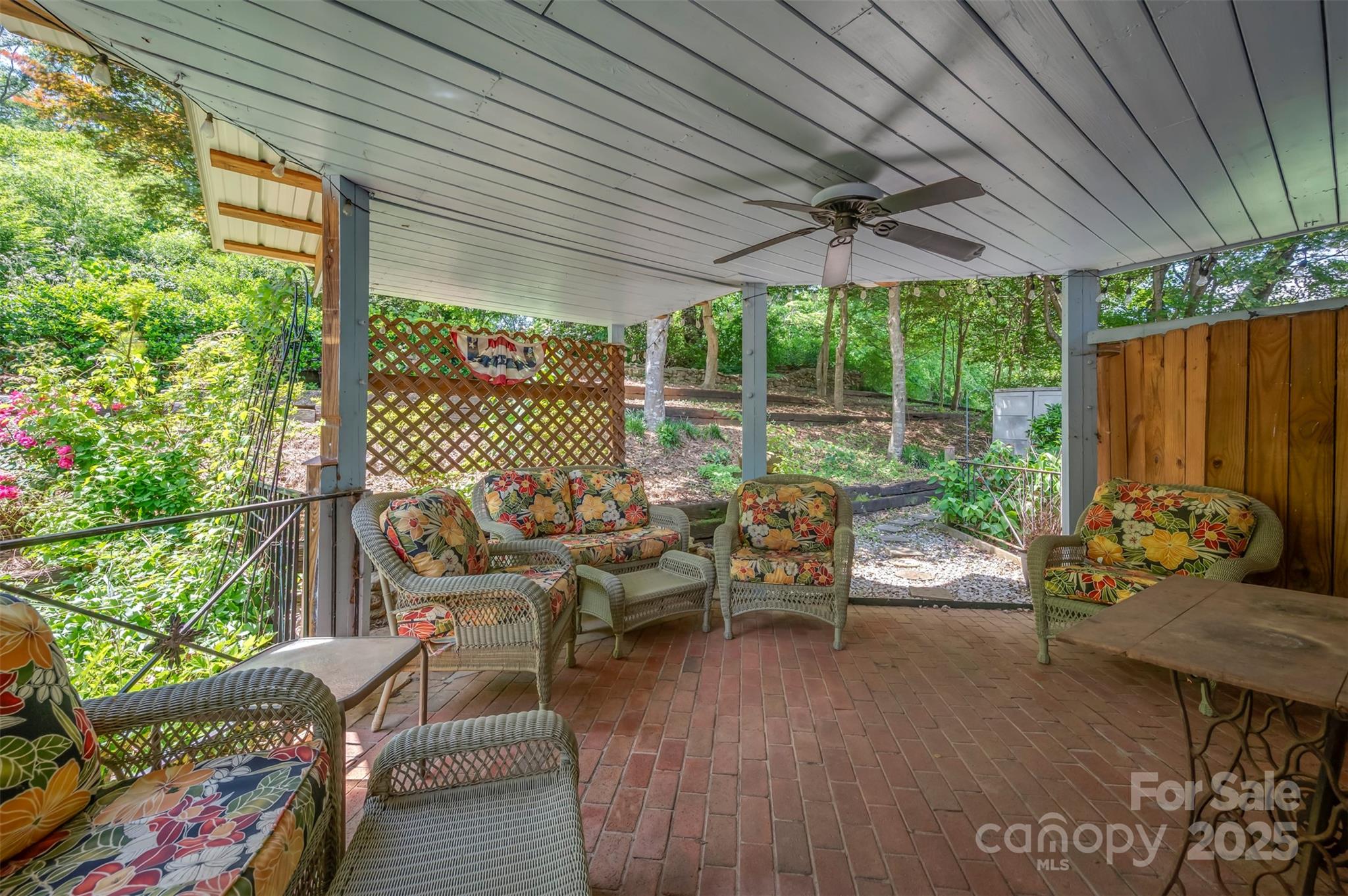 147 Anne Street Rutherfordton, NC 28139 - Photo 25 of 31 a living room with patio furniture and a floor to ceiling window