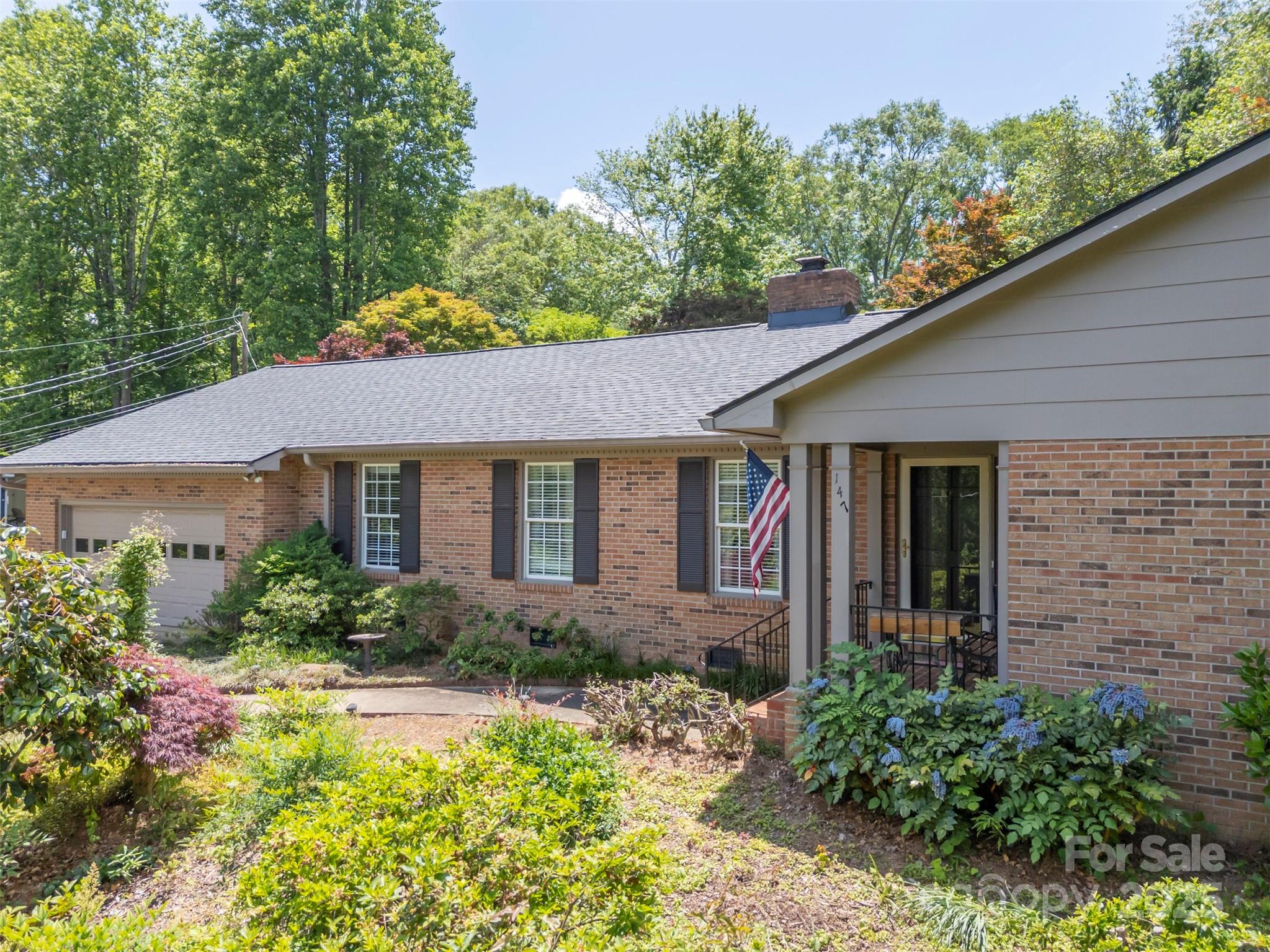 147 Anne Street Rutherfordton, NC 28139 - Photo 5 of 31 a front view of a house with garden