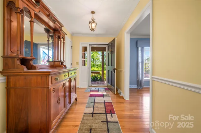 a hallway with a large window and mirror