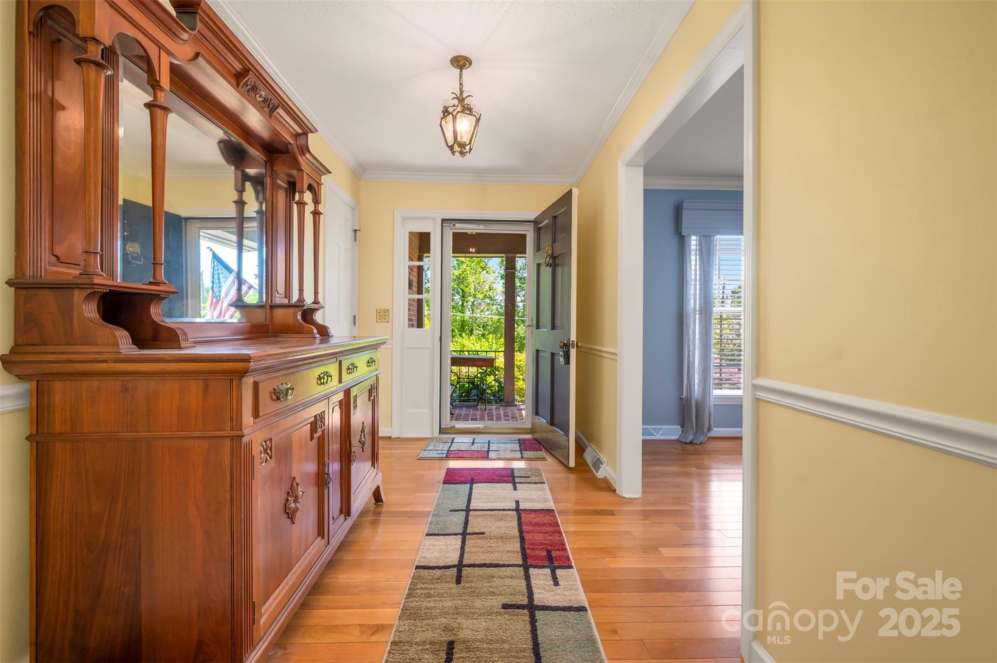 147 Anne Street Rutherfordton, NC 28139 - Photo 6 of 31 a hallway with a large window and mirror