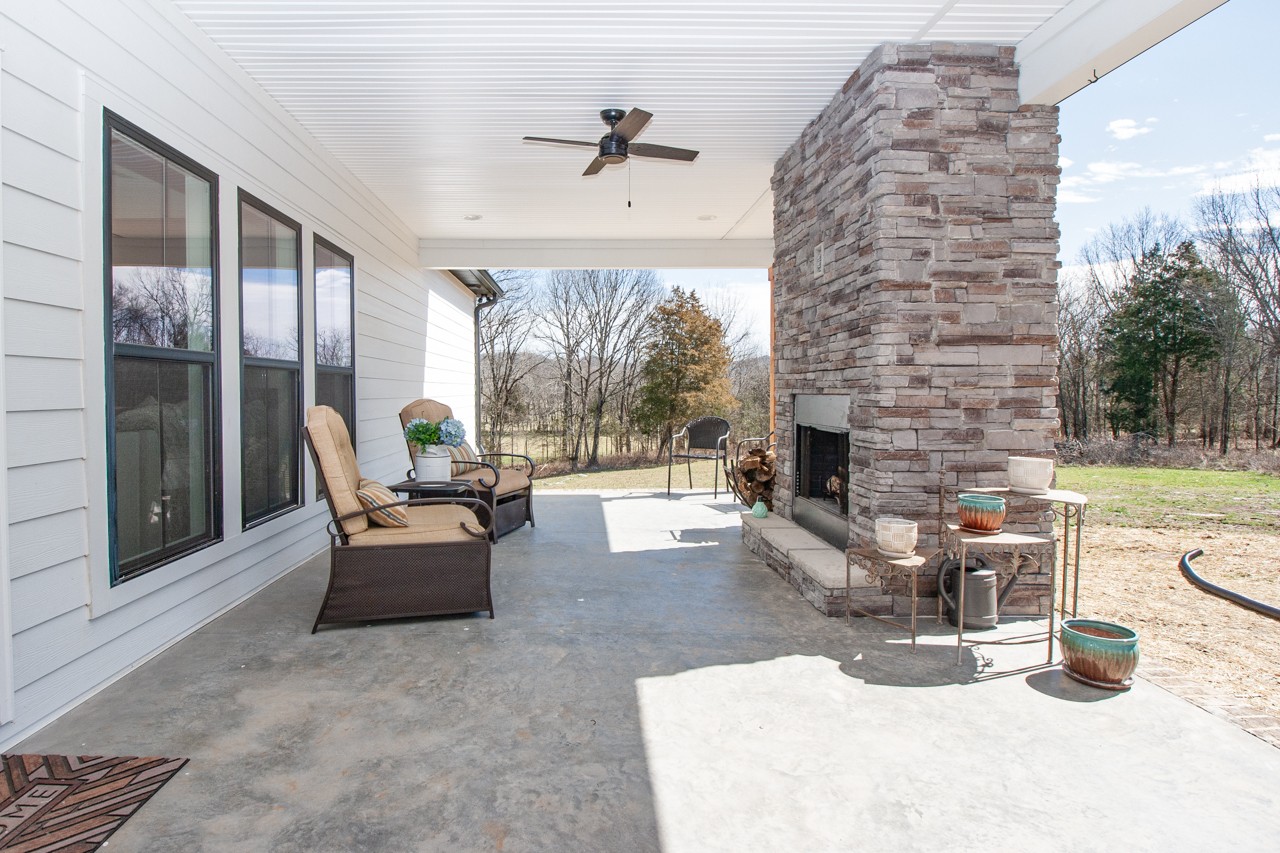 1190 Greenvale Road Milton, TN 37118 - Photo 17 of 21 a living room with furniture and a fireplace