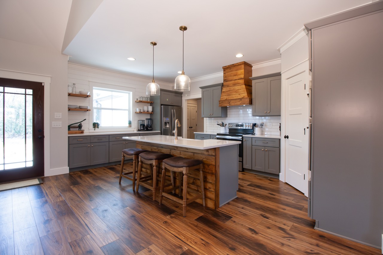 1190 Greenvale Road Milton, TN 37118 - Photo 6 of 21 a kitchen with stainless steel appliances granite countertop a sink a stove and a wooden floor