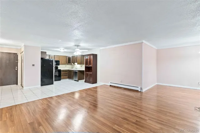 a view of a kitchen with wooden floor