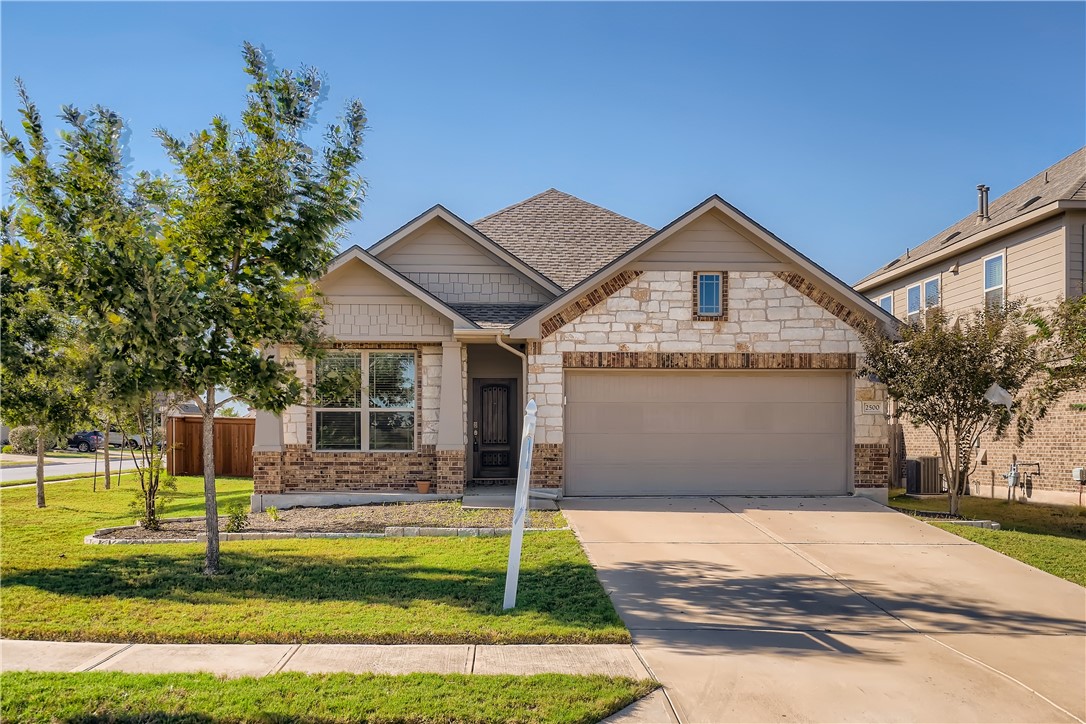2500 Rough Berry Road Pflugerville, TX 78660 - Photo 1 of 1 a front view of a house with a yard
