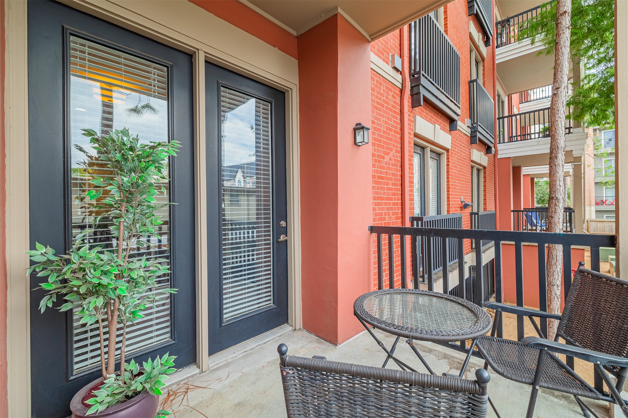2400 McCue Road, Unit 144 Houston, TX 77056 - Photo 10 of 24 a view of a chair and table in the balcony